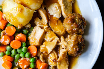 Traditional British Favourite Roast Chicken Sunday Meal With Vegetables And Stuffing