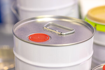 Industrial metal barrel with red plastic lid and silver handle, realistic style, safe storage concept for flammable liquids