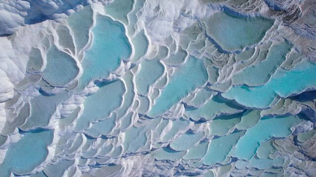 Aerial view Pamukkale nature terraces travertine pools with blue water, Denizli landmark of Turkey.