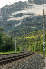 Railway with Austria trains in summer evening near Pfarrwerfen Austria