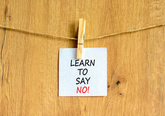 Learn to say no symbol. Concept words phrase Learn to say no on beautiful white paper on wooden...