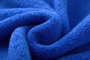 Beautiful close-up view of vibrant blue fleece fabric showcasing intricate texture and softness for creative projects and designs