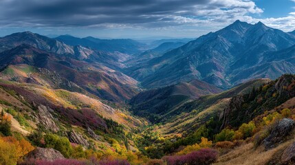 Naklejka premium Scenic overlook captures colorful autumn foliage blanketing the majestic mountains of Neffs Canyon in Utah during the daytime