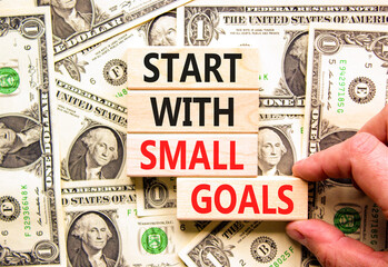 Start with small goals symbol. Concept words phrase Start with small goals on beautiful blocks....