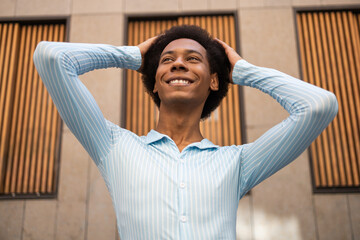Confident urban non-binary individual smiling brightly