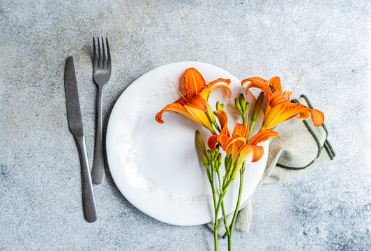 Tiger lily flowers elegantly placed on a dining plate