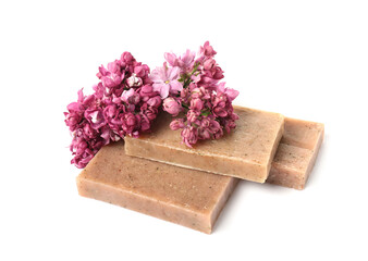 Soap bars and lilac flowers isolated white
