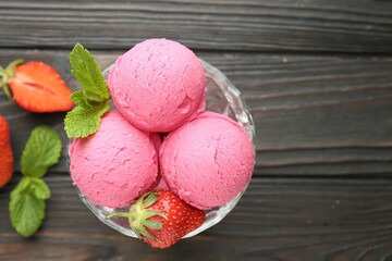 Tasty sorbet with strawberries and mint served on wooden table, flat lay. Space for text