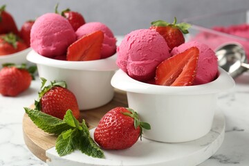 Refreshing sorbet, strawberries and mint on white marble table against grey background, closeup