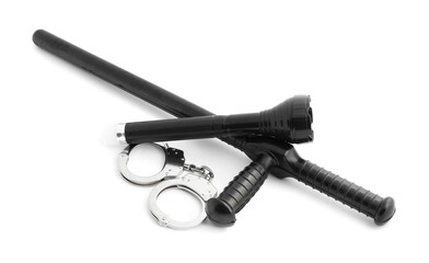 Police baton, flashlight and handcuffs on white background