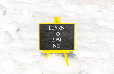 Learn to say no symbol. Concept words phrase Learn to say no on beautiful black blackboard....
