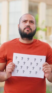 Question Mark, Vertical Video of Confused Bald indian Man Holding Question Mark Poster