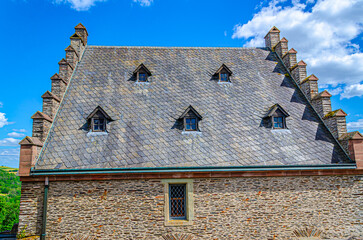 old house with blue sky and clouds