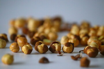 Crispy Roasted Channa chickpeas scattered on white background.
