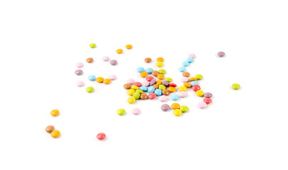 Scattered small candies isolated. Colorful dragees, multicolored glazed chocolate buttons