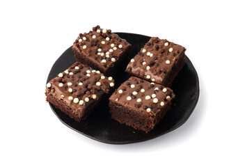 Chocolate brownie cake sprinkled with white and dark balls, classic birthday brownie square piece