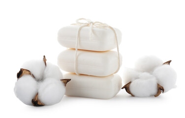 Stack of soap bars and cotton flowers isolated on white