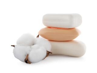 Stack of soap bars and cotton flower isolated on white