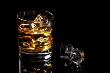 A refined glass of whiskey on the rocks