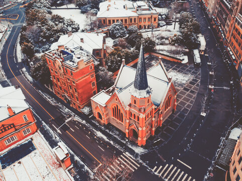 Red Church in Snowy City - Powered by Adobe