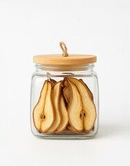 Glass jar with wooden lid filled with dried pear slices, isolated on white background. Natural preserved fruit, healthy snack or zero waste kitchen storage concept.