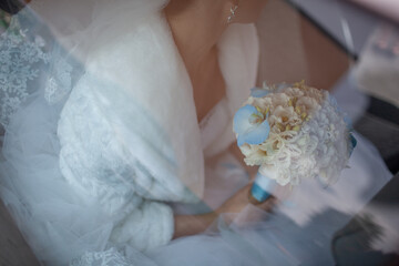 Bride holding wedding bouquet