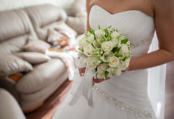 Bride in white wedding dress holding flowers