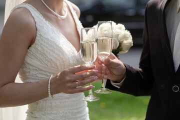 Bride and groom toasting with champagne glasses