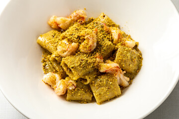 Creamy rigatoni pasta with rich golden cheese sauce & herbs. Classic Italian comfort food with...