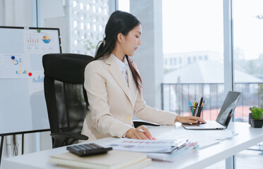 Asian Businesswoman Working at Desk