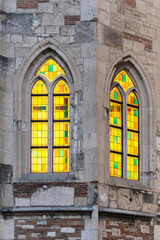 Medieval church tower ruin with colorful stained glass windows