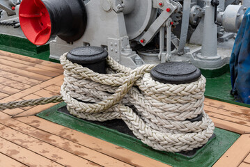 Mooring rope on a bollard on a ship.