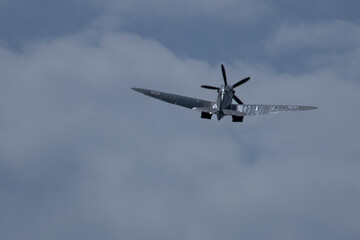 Spitfire plane in flight on sunny day. High quality photo