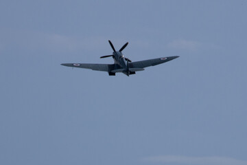 Spitfire plane in flight on sunny day. High quality photo