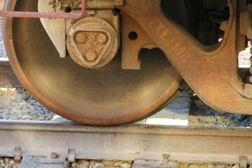 close up of wheel of a  steam locomotive