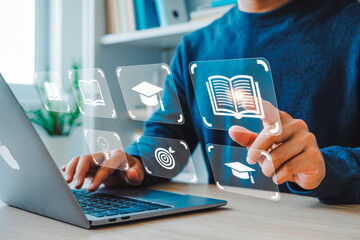 Person engaging with virtual educational icons on a laptop represents modern e-learning. The interface displays books, graduation caps, and targets, symbolizing online education innovations.