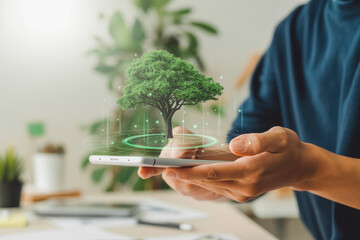 Person holds a smartphone with a digitally projected tree hovering above. Eco-friendly. The concept emphasizes technology merging with nature, featuring a lush green tree against a blurred background.