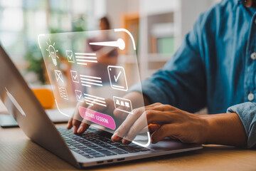 A person using a laptop with a futuristic transparent interface displaying digital learning tools and a "Start Lesson" button. Blurred background suggests a modern office setting.