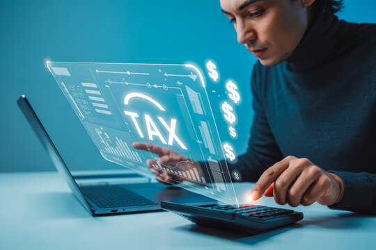 A person uses a laptop and calculator, focusing on digital tax calculations. A holographic tax icon and dollar symbols float, emphasizing technology in finance and tax preparation.