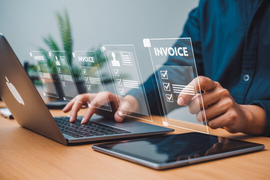 A person uses a laptop with digital invoices displayed in augmented reality, highlighting efficient technology integration. Modern workspace setting with tablet and plants visible nearby.