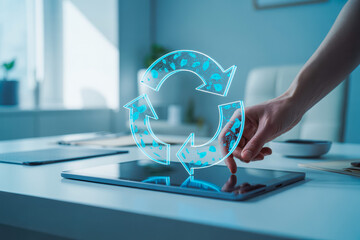 A hand interacts with a digital recycling symbol on a tablet, emphasizing sustainability and technology integration in modern offices. The setting is bright, offering a futuristic feel.