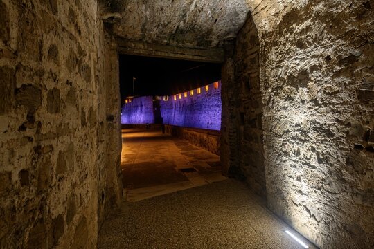 Stone tunnel entrance at Murallas Reales in Ceuta by night