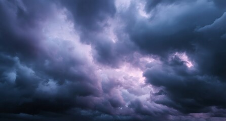Fototapeta premium Massive storm clouds forming before a thunderstorm with deep shades of purple and grey