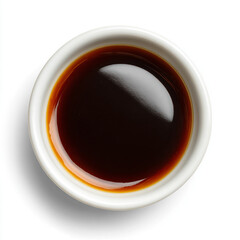 Soy sauce in a small white ceramic cup, isolated on a white background