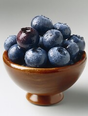the image showcases a wooden bowl filled with fresh, vibrant berries