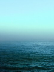 Obraz premium Smooth gradient of oceanic blues and greens with a subtle misty texture for a calming effect