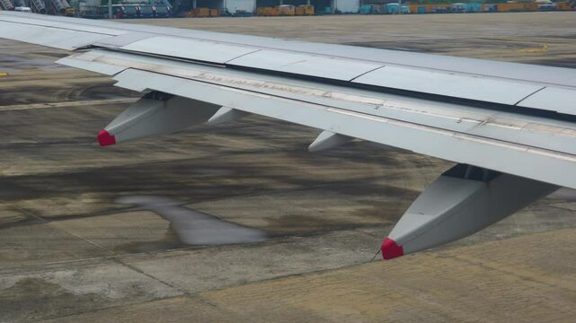 View of the wing flaps during taxiing before take off