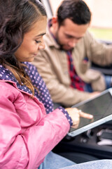 Couple traveling using gps navigation on tablet in car