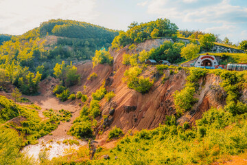 Gant, Hungary, view of the terraces of an old bauxite mine and bauxite formation with red and...