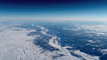 Winter landscape with snow-covered forests and frozen rivers visible from aircraft